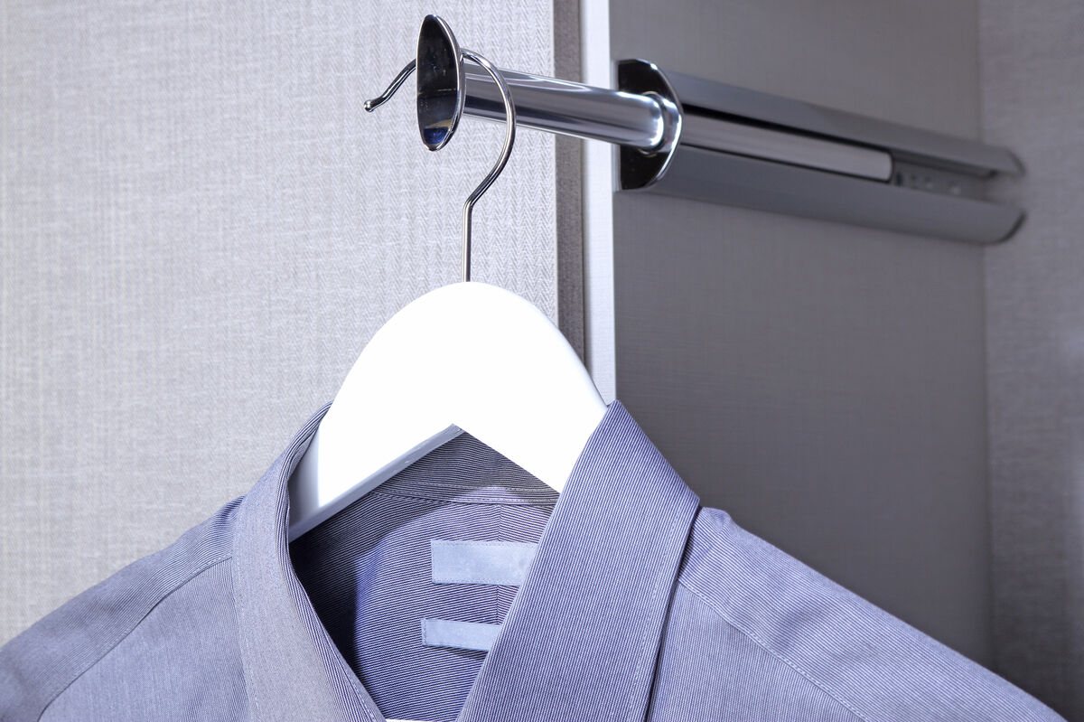 Polished chrome valet rod with hanging shirt