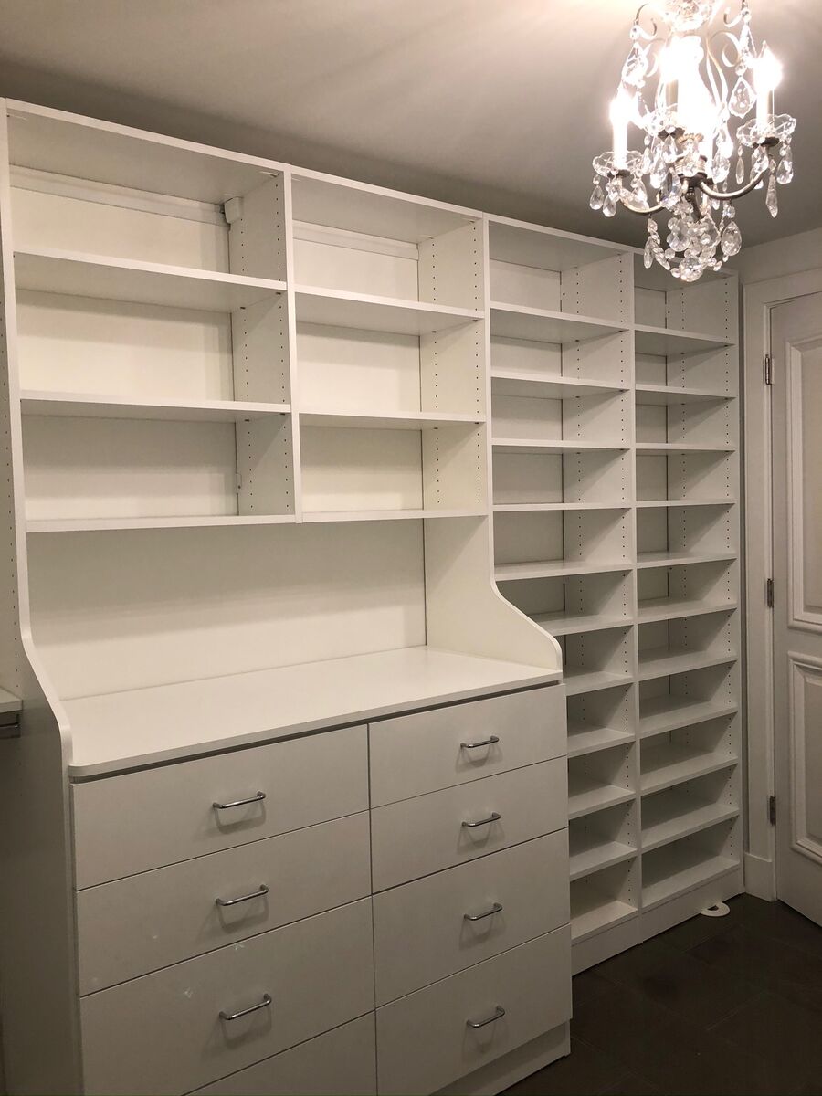 White closet shelving with chandelier