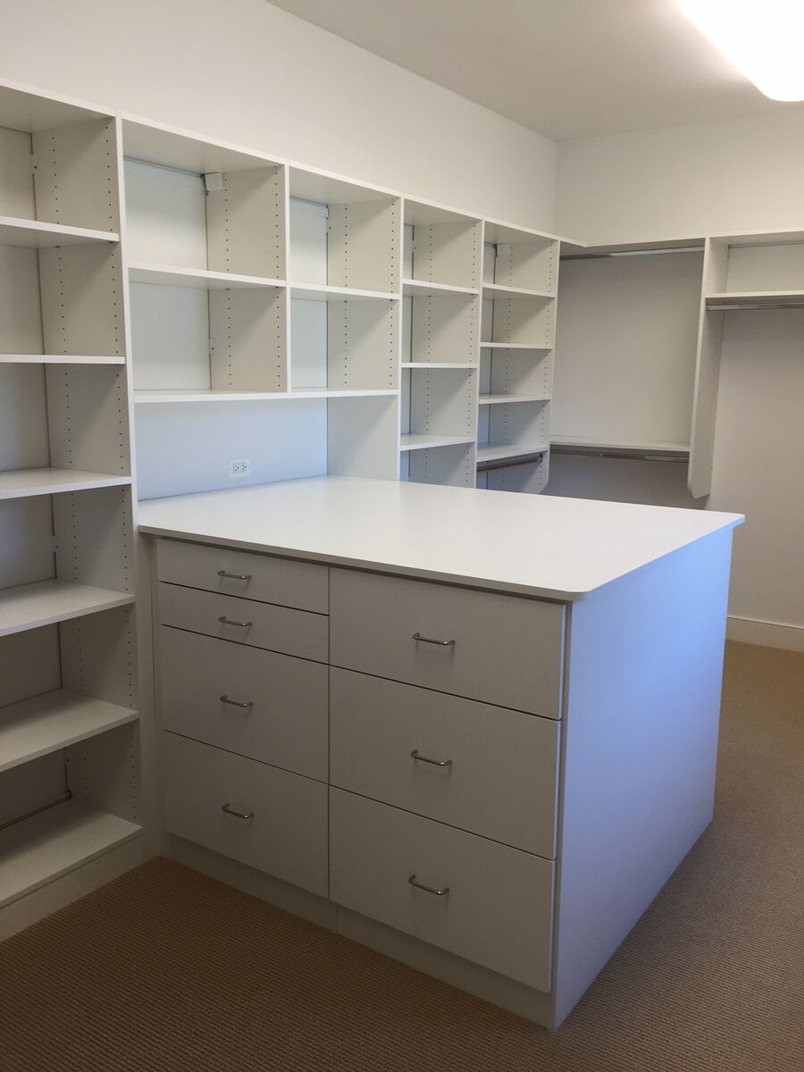 White walk-in closet with island